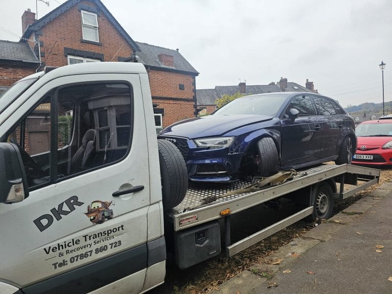 DK’s Recovery truck carrying a recovered car in Sheffield