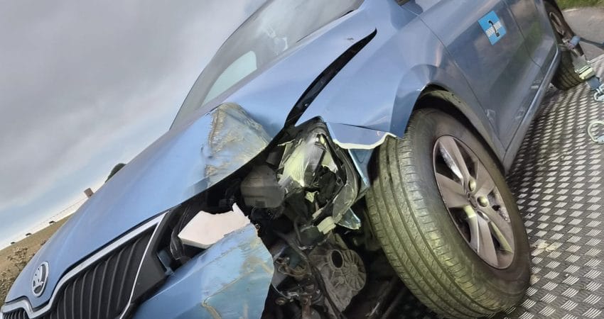 Accident-damaged car waiting for recovery